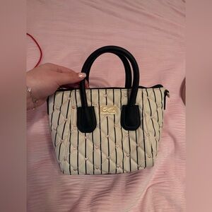 Elegant Cream and Black Quilted Satchel